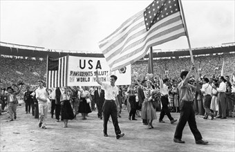 Sixth world festival of youth and students in moscow, delegation from the usa marching during the grand opening ceremonies at the lenin central stadium, july 28, 1957.