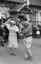 Sixth world festival of youth and students in moscow, july 1957, american participants visiting the luch kolkhoz in the krasnogorsk district near moscow, arby maslin dancing with a young kolkhoznitsa,...