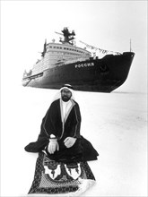 Dr, ibrahim alam, the first saudi arabian who has been to both poles, praying at the north pole where he was taken as a tourist aboard the soviet ice-breaker 'rossiya' in the 1rst international cruise...