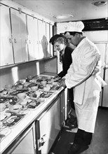 Meals being prepared in the kitchen aboard a tu-114 airliner (at the time, the world's largest), 1959.