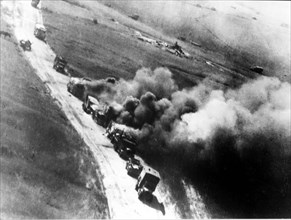 A column of german trucks on fire after a raid by the soviet aviation, voronezh front, july 1943.