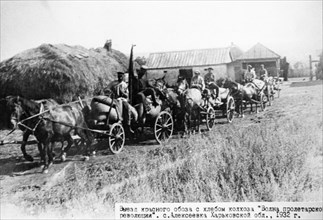A string of carts with bread confiscated from peasants oof the village of alexeyevka in the kharkov region of the ukraine, 1932.