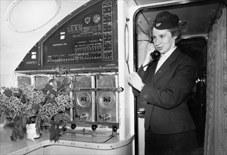 A stewardess taking dinner orders aboard a tu-114 airliner (at the time, the world's largest), may 1959.