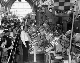 A machine that produces bushings for harvesters' cutting devices on display in the central hall of the ussr economic achievements exhibition in moscow ussr 1959.