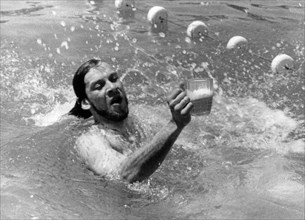 A member of the beer lovers' party preparing for the olympics, sochi, ruslla, july 1994.