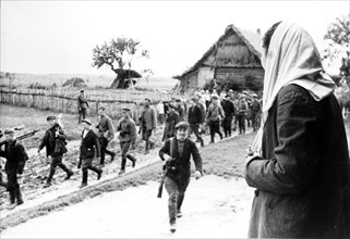 A partisan meets his mother when marching through his native village in leningrad region during world war ll.