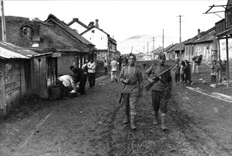 Operation august storm (battle of manchuria), soviet soldiers patrolling a liberated town in manchuria after the surrender of the japanese army on september 2, 1945.