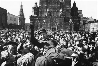 Victory day celebration in red square, moscow, ussr, may 1945, people celebrating the end of world war 2 in europe.