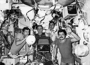 Soyuz tm-4, soviet cosmonauts (l to r) aleksandr pavlovich aleksandrov, anatoly levchenko, vladimir titov, and musa manarov aboard the mir space station, 1988.