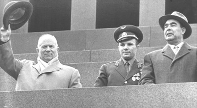 Nikita khrushchev with yuri gagarin and leonid brezhnev on the rostrum of lenin's tomb in red square on may 1, 1961.