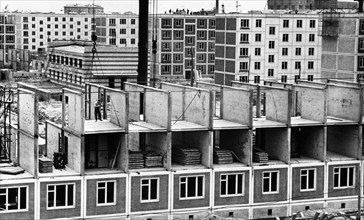 Construction of apartment buildings using pre-fabricated panels in moscow, ussr, 1961.