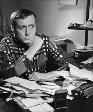 Poet yevgeny yevtushenko at his desk, january 1963.