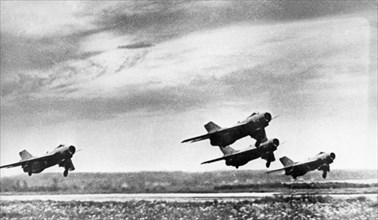 A squadron of soviet mikoyan-gurevich mig-19 'farmer' jet fighters taking off, 1964.