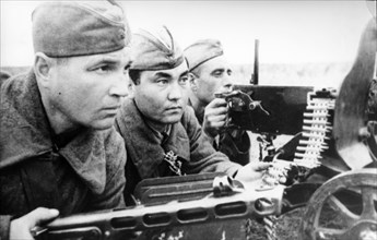 Russian kolesnikov, kirghiz azhekinbayev and ukrainian chepenev, a machine-gun team was fighting against fascists near stalingrad in 1942.