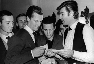 American singer, actor and director dean reed signing autographs for fans in moscow, ussr, 1966.