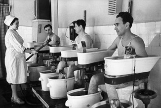 Soviet health resorts, vacationing workers undergoing treatments of sulphuretted hydrogen baths in novoya matsesta on the black sea in the caucuses, july 1968.
