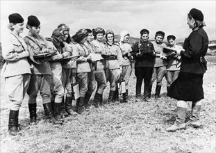 Women pilots of the 46th taman guards night bomber regiment (named by the germans the 'night witches') receiving orders for an up-coming raid, byelorussian front, world war 2, 1944, they flew polikarp...