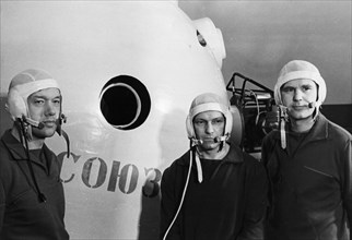 The crew of the soyuz 10 spacecraft (l to r) flight engineer alexei yeliseyev, test engineer nikolai rukavishnikov, and commander vladimir shatalov, april 1971.