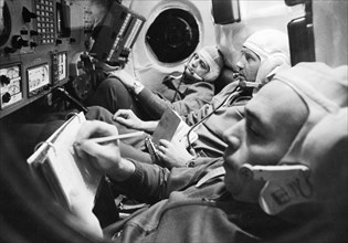 The crew of the soyuz 11 mission: test engineer viktor patsayev, commander georgi dobrovolsky, and flight engineer vladislav volkov in the cabin of the spacecraft, june 1971.