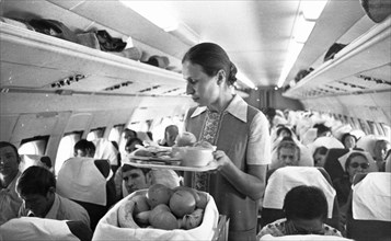 Pasengers being served during an aeroflot flight to tokyo, september 1973.