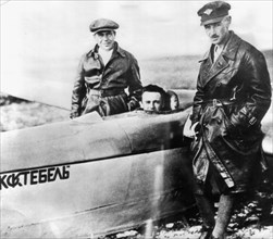 Sergei korolyov in the cockpit of the glider, koktebel in the crimea in 1929, with him are the glider's designer, s, n, liushin (left) and pilot k, artseulov.