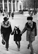 A young russian family, alexander rusov, a chemist and fiction writer, out walking with his wife irene and their daughter ann, moscow, ussr, 1975.