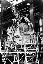 Soviet lunar lander luna 24 in the assembly shop prior to it's mission, in the foreground is it's 'soil in-taker' (boring mechanism), august 1976.