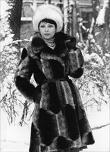 Model wearing winter coat made of artificial fur by vympel clothing firm, moscow, ussr, 1977.