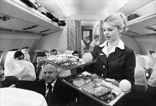 Petropavlosk-kamchatsky flight in 8 hours, irina naumova, the head of the stewardesses' brigade, serving food in the plane's saloon, 1978.