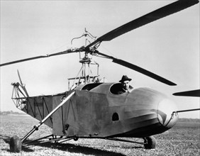 Igor sikorsky in the cockpit of one of the world's first helicopters that he built, the bc-300, 1943.