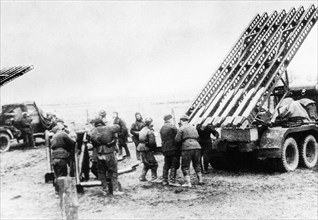 The picture shows the famous 'katyusha', truck-mounted multirail rocket launcher, in a firing position.