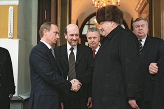 Moscow, russia, outgoing russian president boris yeltsin (r) shaking hands with russian prime minister and acting president vladimir putin (l) as he leaves moscow's kremlin, the seat of russian power,...