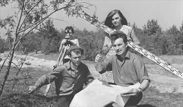 Kiev region, ukrainian ssr, ussr, a group of geodesists measuring the territory at the construction site of the chernobyl nuclear power plant, june 6, 1971, l-r: mikhail chikalovets, vladimir sloboden...