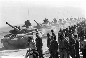 A column of the soviet tankers leaving afghanistan for their motherland , the withdrawal of the soviet forces was concluded on february 15, 1989.