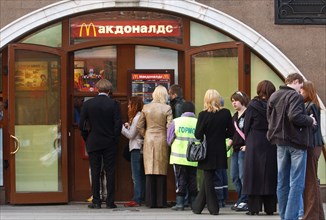 Moscow, russia, people queueing to buy food from the mcdonald's restaurant in central moscow's manezh square, fast food is rather popular with muscovites, april 26, 2006.