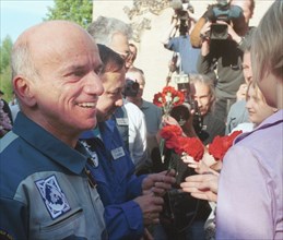 May 6, 2001, american space tourist dennis tito seen being welcomed in the chkalovsky airfield in the moscow region, on sunday, the crew ended an eight-day visiting expedition to the international spa...