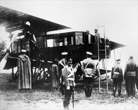 Nicholas ll and igor sikorsky, aircraft designer, are seen in cabin of igor sikorsky's the grand, 1913.