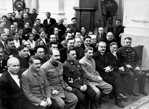 Moscow, ussr, 1936, josef stalin (front row, 4th from right) with other delegates of the 8th extraordinary all-union soviet congress, khrushchev is seated in the lower left corner, soviet communist pa...