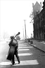 World war 2, stalingrad, ussr, august 1942: a contrabass player on a stalingrad street .