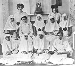 World war one, russia, the personnel of the dispensary of the tsarskoye selo grand palace, 1915: (second row, sitting from left) empress alexandra fyodorovna and grand duchesses olga nikolayevna and t...