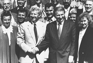 Ukrainian president leonid kuchma (right) and chairman of the ukrainian supreme soviet alexander moroz shaking hands and congratulating each other on june 28, 1996 on the ukrainian parliament's has ap...
