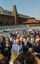 Ronald reagan with mikhail gorbachev in red square with reporters during his visit to the ussr, may 1988.