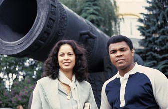 American boxer, muhammad ali, with his wife veronica standing by the tsar cannon in the kremlin during their visit to the soviet union in 1978.