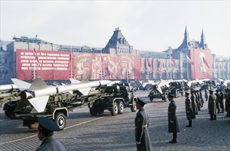 Trucks bearing sa-2 surface-to-air missiles at a military parade in red square celebrating the 66th anniversary of the great october socialist revolution, november 7, 1983, moscow, ussr.