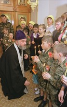 Kemerovo region, russia, january 31, 2002, father nikolai anointing with chrism young cadets (in pic) from orphanage in novokuznetsk (a city in siberia), about 20 inmates from 3 to 17 years old were b...