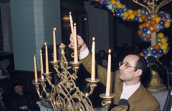 Observance of hanukkah at the choral synagogue in moscow, russia, december 1999.