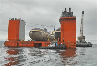 Maritime territory, russia, july 10, 2009, dutch ‘transshelf’ transport vessel carrying two shchuka class nuclear-powered submarines on board arrives at far eastern shipyard zvezda, the decommissioned...