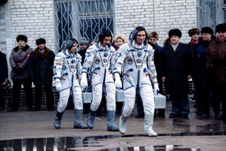 Baikonur cosmodrome,russian-german space mission crew is heading to the launching pad for a take-off on board soyuz tm-25 space ship, l-r are german astranaut-researcher 40-year old reinhald ewald,boa...