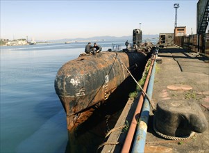 Maritime territory, russia, august 4, 2004, another ship waiting for its turn at the facility for nuclear-powered submarines utilization, the 'zvezda' plant in the city of bolshoy kamen is occupied wi...