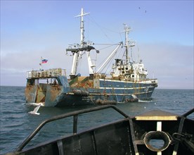 Petropavlovsk-kamchatski, russia, a fishing vessel with a floating fish processing plant on board, in the sea of okhotsk, august 12, 2004.